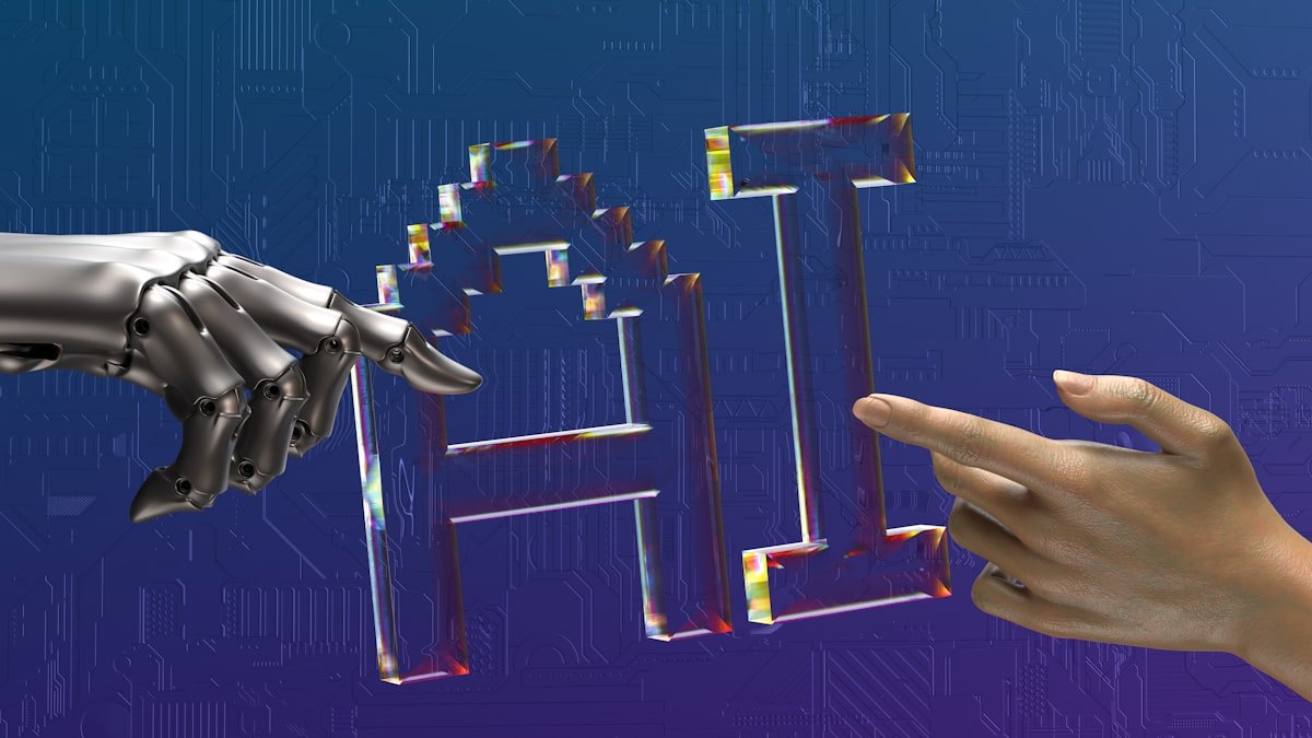 Human and AI collaboration in software development - robot hand meets human hand